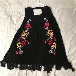 Black tank with embroidered flowers and tassels